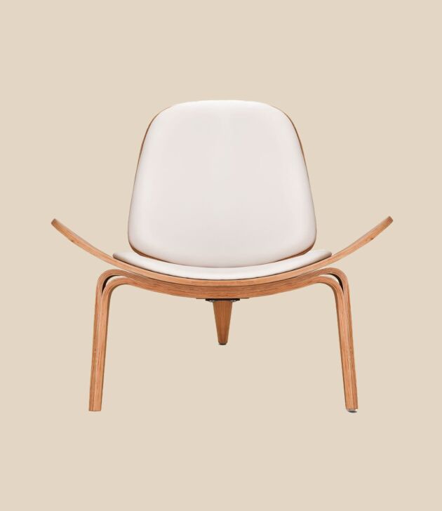 White molded accent chair with wood frame